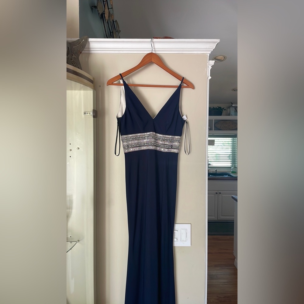Brand new, navy blue with silver embellished jeweled waistband evening gown.
